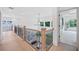 Open hallway with stylish railings, offering a view of the living room below and access to other rooms at 461 Maypop Ln, Woodstock, GA 30188