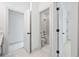Hallway view showcasing bathroom and bedroom doors with modern finishes at 461 Maypop Ln, Woodstock, GA 30188