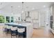 Modern kitchen featuring a large center island, stainless steel appliances and barstool seating at 461 Maypop Ln, Woodstock, GA 30188