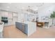 Bright, open kitchen with stainless steel appliances, blue island and eat in kitchen overlooking living area at 461 Maypop Ln, Woodstock, GA 30188