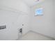 Laundry room with window and hookups, offering convenience and ample space at 461 Maypop Ln, Woodstock, GA 30188