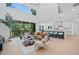 Open-concept living area with soaring ceilings, a fireplace, and large windows offering natural light at 461 Maypop Ln, Woodstock, GA 30188