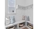 Mud room features bench seating with open storage and wall hooks at 461 Maypop Ln, Woodstock, GA 30188