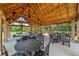 Inviting pavilion interior featuring picnic tables and wooden beam construction at 461 Maypop Ln, Woodstock, GA 30188