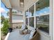 Cozy front porch featuring wicker seating and stylish decor offers a relaxing outdoor space at 461 Maypop Ln, Woodstock, GA 30188