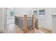 Staircase featuring light wood steps, modern metal railings and natural light at 461 Maypop Ln, Woodstock, GA 30188