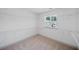 Spacious walk-in closet with ample shelving and storage, flooded with natural light from the window at 461 Maypop Ln, Woodstock, GA 30188