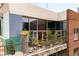 Charming balcony with lush greenery, potted plants, and a cozy seating area at 845 Spring Nw St # Ph4, Atlanta, GA 30308