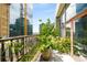 Bright balcony with potted plants, rope railing, and views of the surrounding city skyline at 845 Spring Nw St # Ph4, Atlanta, GA 30308
