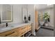 Bathroom features a marble countertop, double sinks, wood cabinet, and views of the sauna and garden at 845 Spring Nw St # Ph4, Atlanta, GA 30308