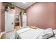 Bedroom with a king-size bed and access to a full bathroom, featuring stylish decor, and hanging plants at 845 Spring Nw St # Ph4, Atlanta, GA 30308