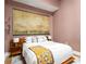 Modern bedroom with a comfortable king-size bed and stylish decor, including a large art piece at 845 Spring Nw St # Ph4, Atlanta, GA 30308