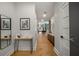 Hallway featuring wood floors, neutral walls, modern decor, and access to other rooms at 845 Spring Nw St # Ph4, Atlanta, GA 30308