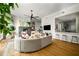 Open-concept living area with a modern fireplace, ample seating, and view into the adjacent kitchen at 845 Spring Nw St # Ph4, Atlanta, GA 30308