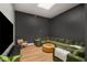 Modern living room with a skylight, hardwood floors, and a large green sectional sofa at 845 Spring Nw St # Ph4, Atlanta, GA 30308
