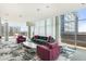 Spacious lounge area with ample seating, modern decor, and floor-to-ceiling windows showcasing cityscape views at 845 Spring Nw St # Ph4, Atlanta, GA 30308