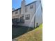 Back of house featuring a deck and a well-kept lawn at 955 Loch Forest Way, Riverdale, GA 30296