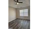 Bedroom with ceiling fan and large window providing natural light at 955 Loch Forest Way, Riverdale, GA 30296