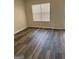 Bright room featuring wood floors, natural light, and neutral paint at 955 Loch Forest Way, Riverdale, GA 30296