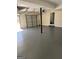 Spacious two-car garage with painted floor at 955 Loch Forest Way, Riverdale, GA 30296