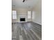 Spacious living room with wood floors, fireplace, and natural light at 955 Loch Forest Way, Riverdale, GA 30296