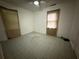View of bedroom with windows and patterned floor at 247 Whitaker Nw Cir, Atlanta, GA 30314