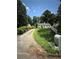Exterior angle view showing the home's side yard, driveway, and manicured lawn at 247 Whitaker Nw Cir, Atlanta, GA 30314