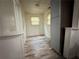 Hallway view of the open floor plan to the kitchen with plenty of natural light at 247 Whitaker Nw Cir, Atlanta, GA 30314