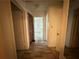 Hallway showcases access to rooms with doors and patterned floors at 247 Whitaker Nw Cir, Atlanta, GA 30314