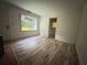 Bright living room featuring hardwood floors, a window, and natural light at 247 Whitaker Nw Cir, Atlanta, GA 30314
