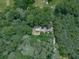 An aerial view of a charming home nestled among mature trees and natural beauty at 337 Theodore Cox Cir, Canton, GA 30114