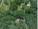 An aerial view showcasing this home, nestled amongst lush greenery and mature shade trees at 337 Theodore Cox Cir, Canton, GA 30114