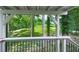 A back porch with a view of the lush green lawn and surrounding trees at 337 Theodore Cox Cir, Canton, GA 30114