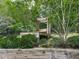 Backyard featuring a wooden bench and surrounded by lush green trees at 337 Theodore Cox Cir, Canton, GA 30114