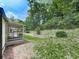 Secluded backyard with a covered porch and tiered landscaping for outdoor enjoyment at 337 Theodore Cox Cir, Canton, GA 30114