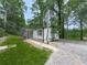 Charming home with a quaint front porch and walkway, nestled amidst mature trees at 337 Theodore Cox Cir, Canton, GA 30114