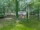 A charming home nestled among trees, showcasing privacy and a tranquil atmosphere at 337 Theodore Cox Cir, Canton, GA 30114