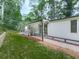 Inviting exterior with a covered porch and well-maintained walkway surrounded by green lawn at 337 Theodore Cox Cir, Canton, GA 30114