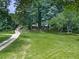 Sprawling property with a long driveway leading to a cozy home surrounded by nature at 337 Theodore Cox Cir, Canton, GA 30114