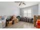 Bright bedroom with a ceiling fan and natural light offers potential for personalization at 4706 Cedar Park Trl, Stone Mountain, GA 30083