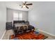 Inviting bedroom with ceiling fan, laminate floors, neutral walls, and natural light creates a cozy atmosphere at 4706 Cedar Park Trl, Stone Mountain, GA 30083