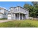 Charming two-story home features a covered front porch and attached garage, perfect for comfortable living at 4706 Cedar Park Trl, Stone Mountain, GA 30083