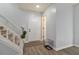 Inviting foyer with neutral paint, attractive floors, and a staircase, offers a warm welcome at 4706 Cedar Park Trl, Stone Mountain, GA 30083