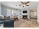 Inviting living room featuring a fireplace, large windows, and an open layout, great for entertaining at 4706 Cedar Park Trl, Stone Mountain, GA 30083