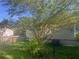 View of a single Gathering home's backyard with a chain link fence and a small storage shed at 3101 E Point St, Atlanta, GA 30344