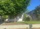 Exterior view of a single Gathering home with green grass, trees and a small fence at 3101 E Point St, Atlanta, GA 30344