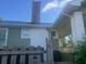 An exterior side angle of a single Gathering home with a red brick chimney and a small covered porch at 3101 E Point St, Atlanta, GA 30344