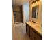 Updated bathroom featuring a double sink vanity, tile floors and modern lighting at 1053 Metropolitan Parkway Southwest Sw Pkwy, Atlanta, GA 30310
