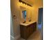 Updated bathroom featuring double sinks, tile floors, and modern vanity lighting at 1053 Metropolitan Parkway Southwest Sw Pkwy, Atlanta, GA 30310