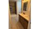 Updated bathroom featuring a double sink vanity, tiled shower, and modern lighting at 1053 Metropolitan Parkway Southwest Sw Pkwy, Atlanta, GA 30310